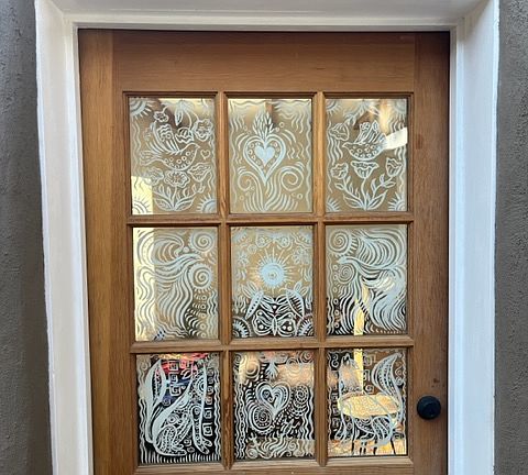 Hand painted front door of casita.
