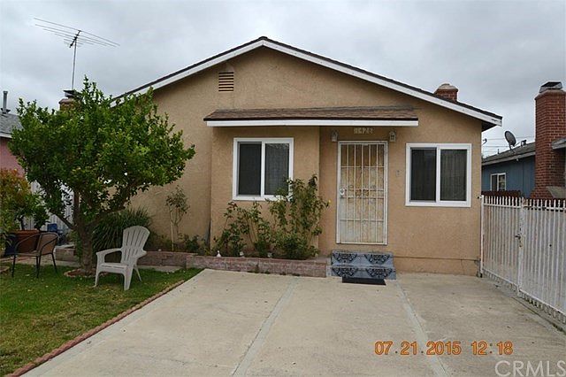 Front view; Dual-paned windows throughout; Front yard enclosed w/wrought-iron fencing