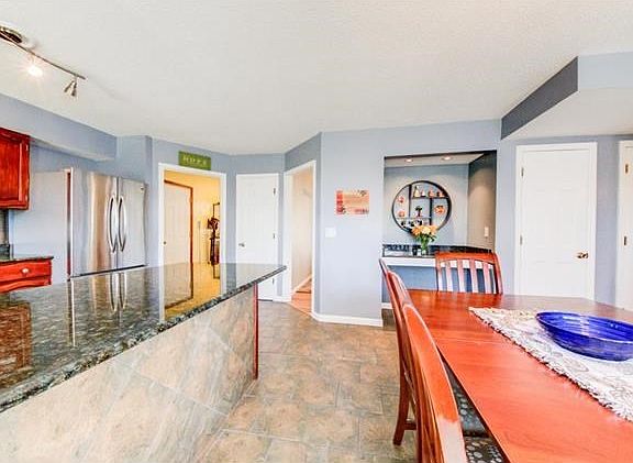 Not 1 but 2 Pantries, a planning desk alcove (with lights) and granite counter tops hang over for possible bar stools for that morning bowl of cereal. Plus another Utility closet for those brooms, mops, cleaning supplies. Wow, a Woman or Man's Dream Kitch