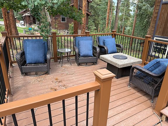 Trex deck area in front. New yard furniture and Gas fire pit.