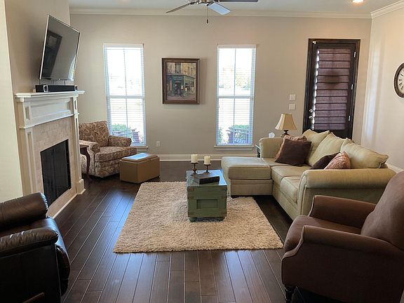 Spacious living room. TV mount above fireplace. Gas fireplace.