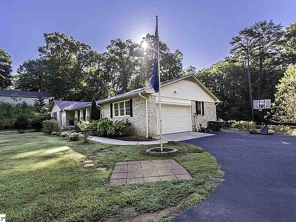 Long driveway with extra pad.