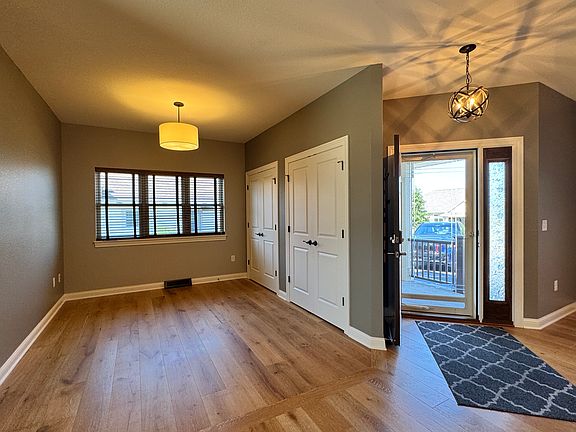 View from the kitchen into the office or sitting area showing 2 large closets.
