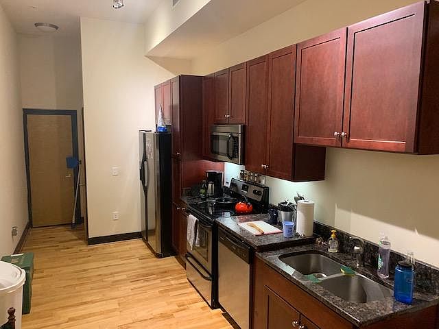 nice kitchen with granite and stainless steel appliances