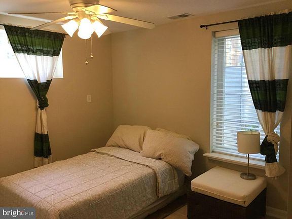 Third bedroom in the finished basement with an egress window.