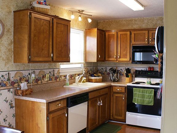 Kitchen leads out to deck and private patio