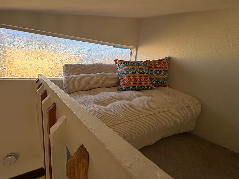 Couch in loft. Perfect place to relax or for kids play.