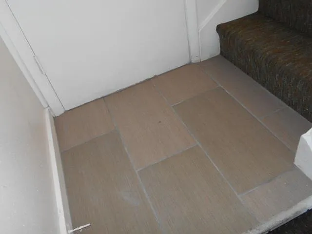 Back stairs and back door to basement from kitchen