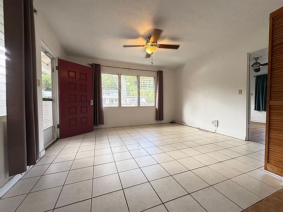 Living area, viewing from the kitchen. Bedroom is on the right.