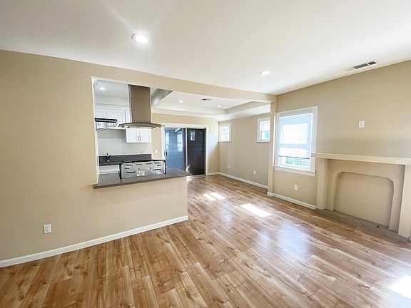 Living Room looking into Kitchen and Dining Area