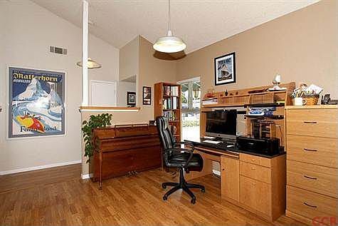 This area adjacent to the kitchen would make a larger formal dining room, if desired.