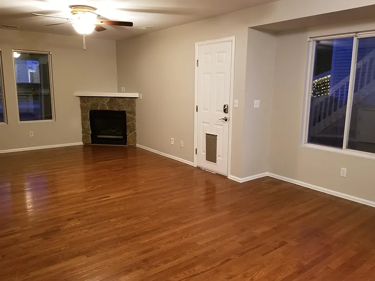 Living room with wood flooring and gas fireplace