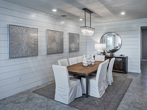 Model Representation Elegant dining room located off gathering, perfect space to host a special din