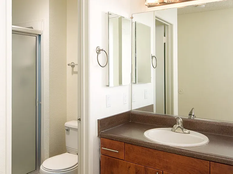 Classic Package I bath with laminate countertop, cherry cabinetry, and hard-surface flooring