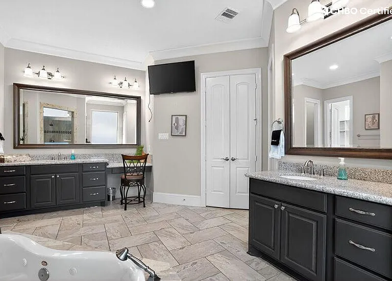Double vanity bathroom with mirrors