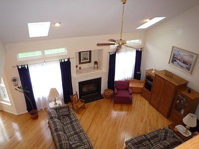 Amazing 2-Story Family Room Graced With Stunning Hardwood Floors!