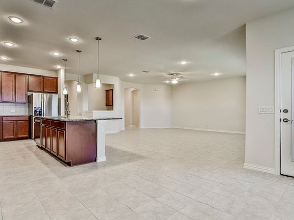 Dining area off of kitchen with access to covered patio