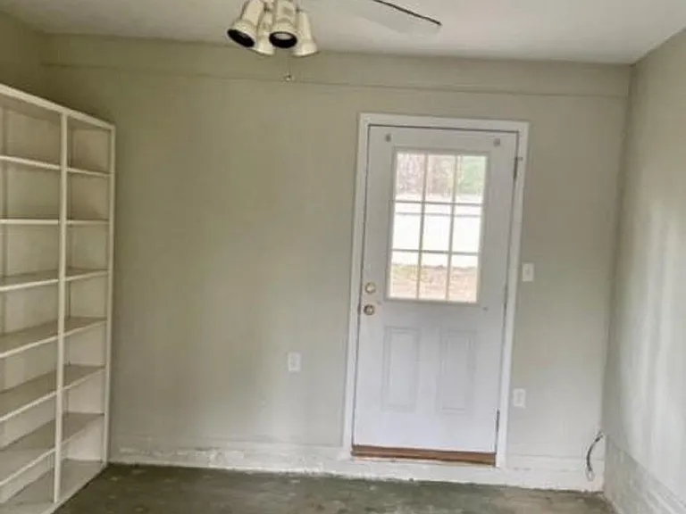 enclosed carport, great for storage.