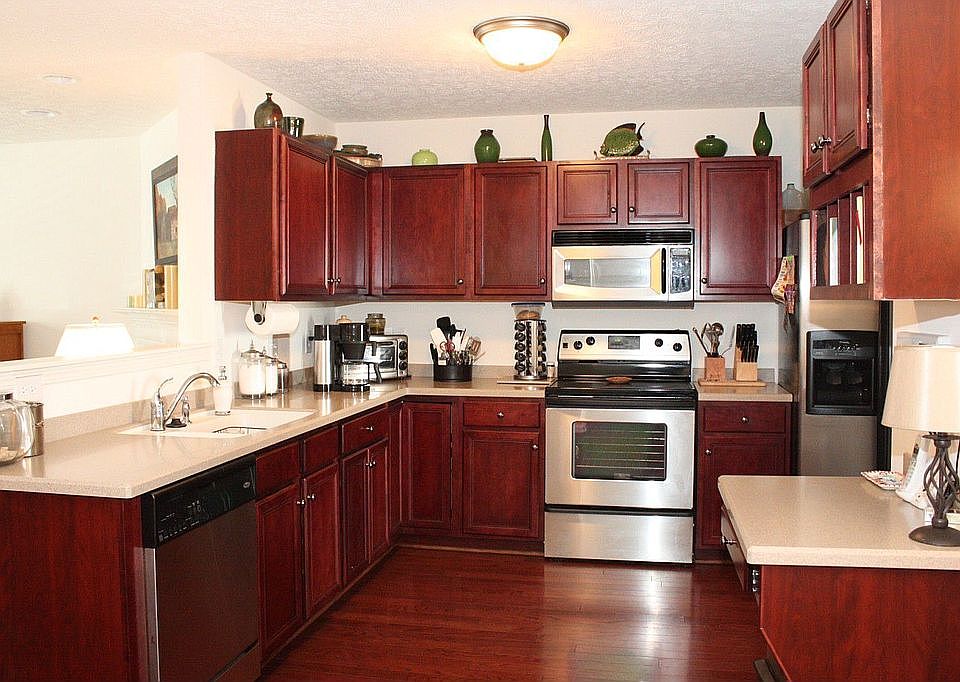 Gorgeous Kitchen with Corian Counters, Cherry Cabinets & Stainless Appliances