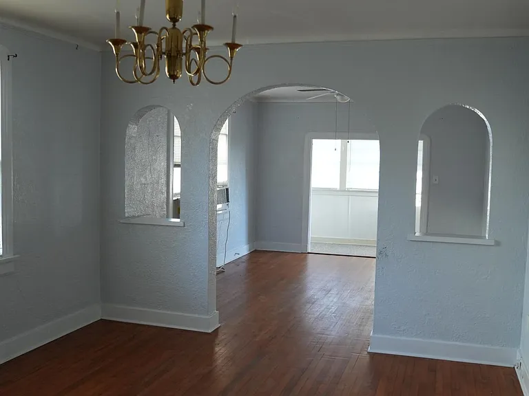 View from kitchen of dining room, living room and sunroom
