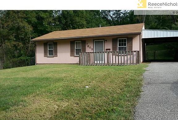 Long Driveway and 2 Car Carport.