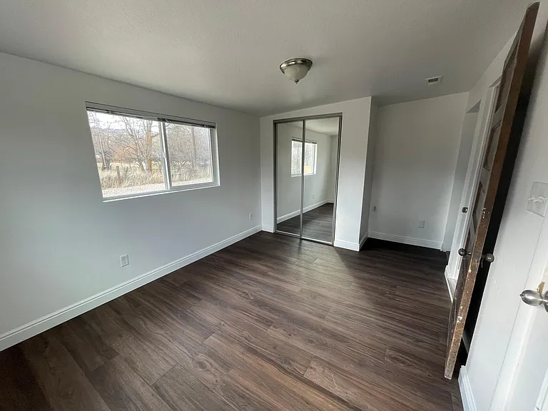 Mudroom, office or dining room - very versatile! Includes entrance from the garage and stairway downstairs