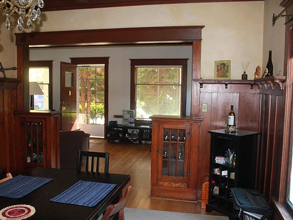 Wainscoting in dining room. Hardwood floors.