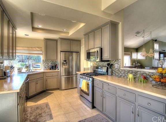 Counter space and cabinets galore, plus stone counters create a chef's paradise.