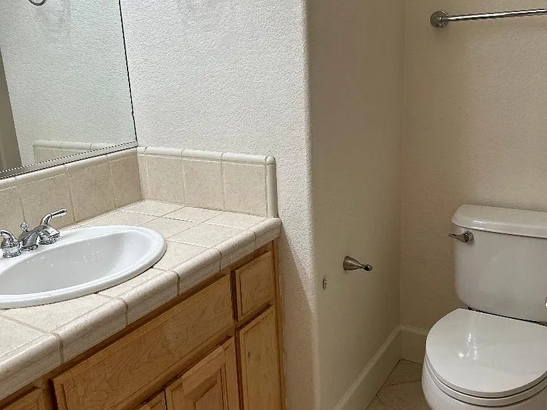 full bathroom with tub downstairs