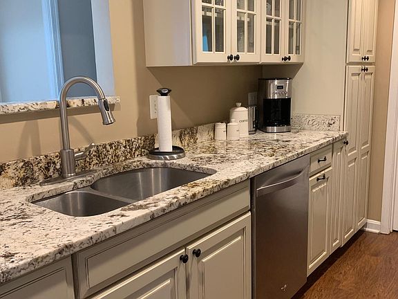 Upgraded galley style kitchen w/ stainless steel dishwasher + pantry