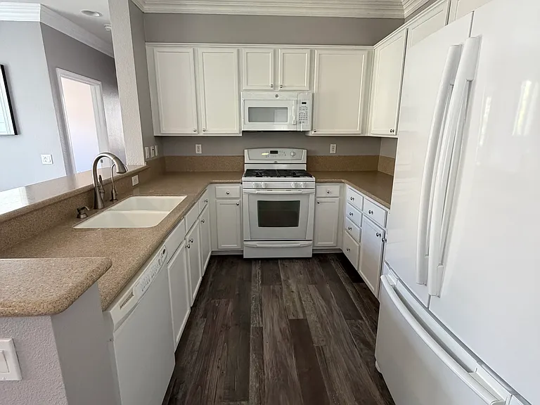 Well-appointed kitchen featuring a brand-new microwave and built-in AquaTru reverse osmosis water filtration system.
