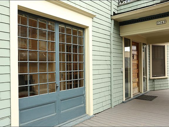 the available apartment is at the rear in this photo, where you see the bay window