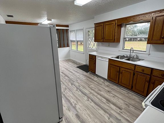 Kitchen view entering from door off of porch area