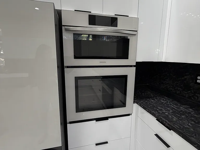 Premium LG Be-Spoke white-glass appliances, including built-in double oven.