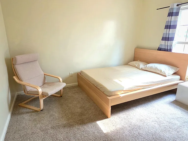 Fully furnished bed room with bed, mattress, walk in closet, arm chair. mirror, lamp, curtains, computer table/chair and private entry to the shared bathroom