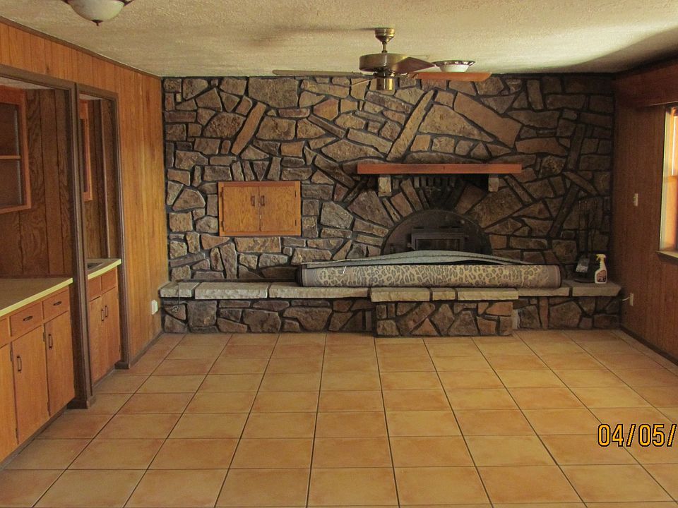 LIving room with fireplace, wet bar and built in bookshelves