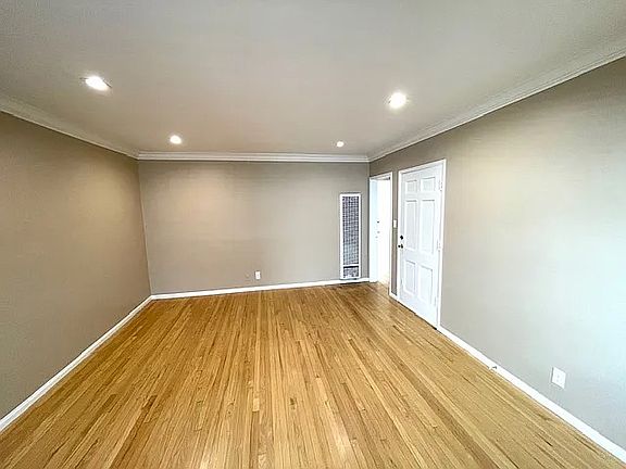 Living Room W/Canned Lighting & refinished hardwood floors