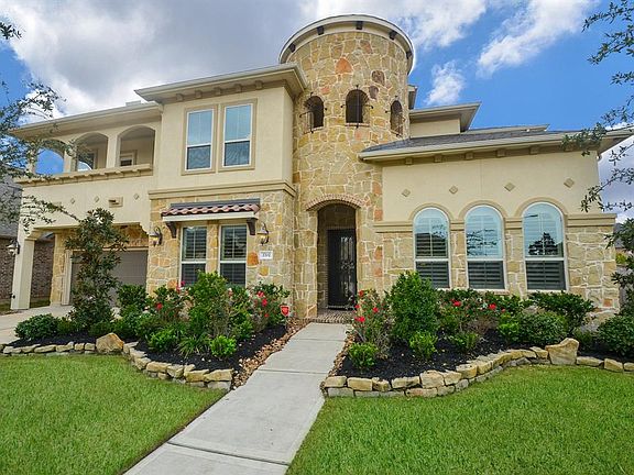 Gorgeous Stone and Stucco exterior. The home is equipped with a water softener and a full sprinkler system.