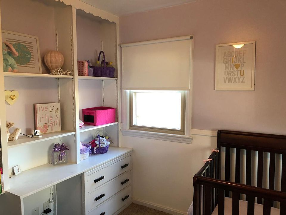 Bedroom 1 with built in book shelf
