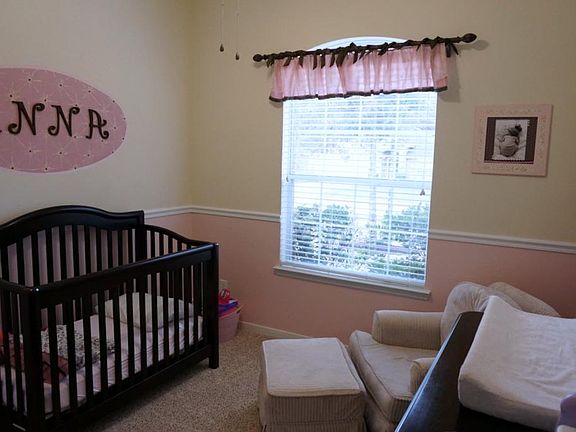 Second bedroom with large window for natural light.