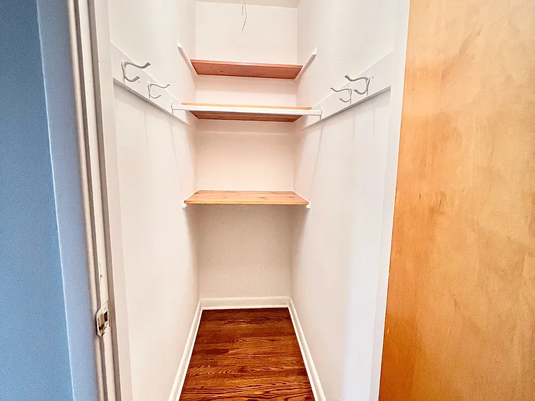 Coat closet entry from living room into hallway