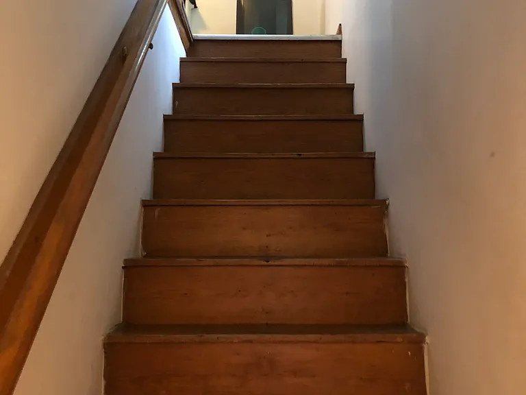 stairway leading to finished upper room