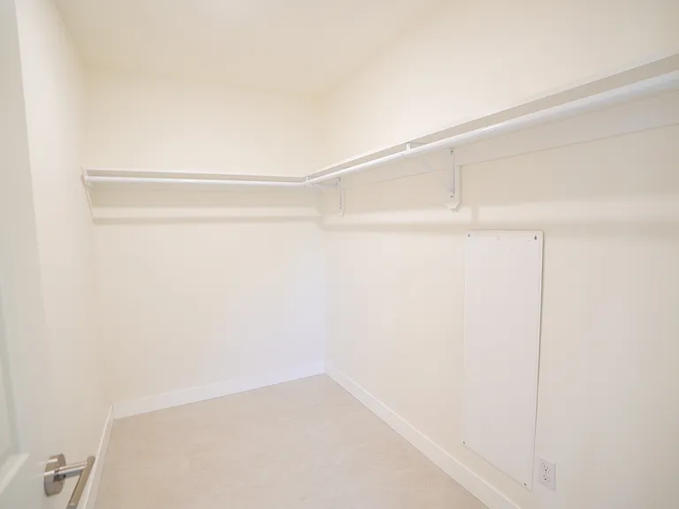 walk-in closet in the master bedroom