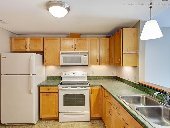 Full Size Refrigerator/Freezer and Range. Built-in Microwave