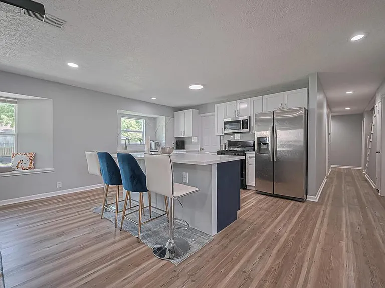 Kitchen with view of corridor