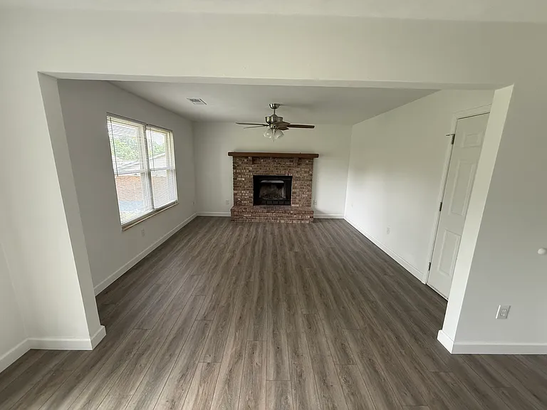 Family room view from dining room. Fireplace is ornamental--no fires can be lit. An electric insert can be used.