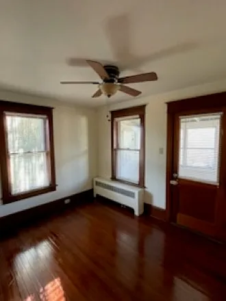 Bedroomn #2 with door to enclosed porch.