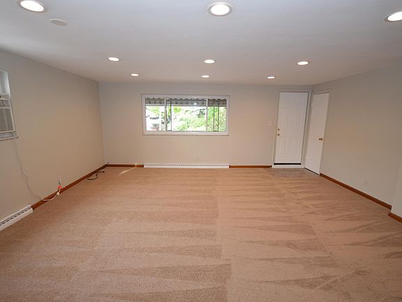 Newly renovated living room. Fresh paint, new carpets, and