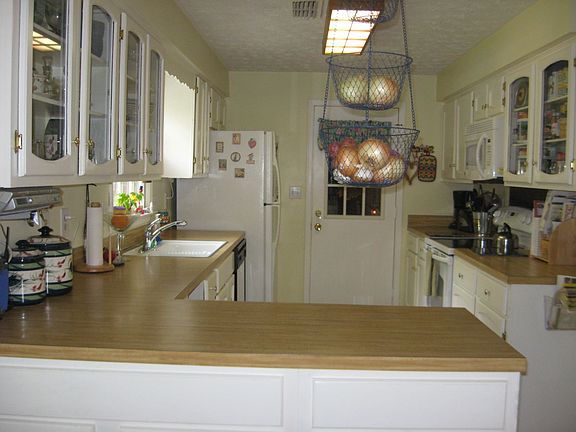 The kitchen exits into the garage. Not far to carry those groceries in. 