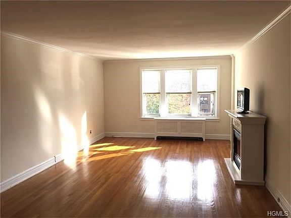 Bright Living Room with faux fireplace